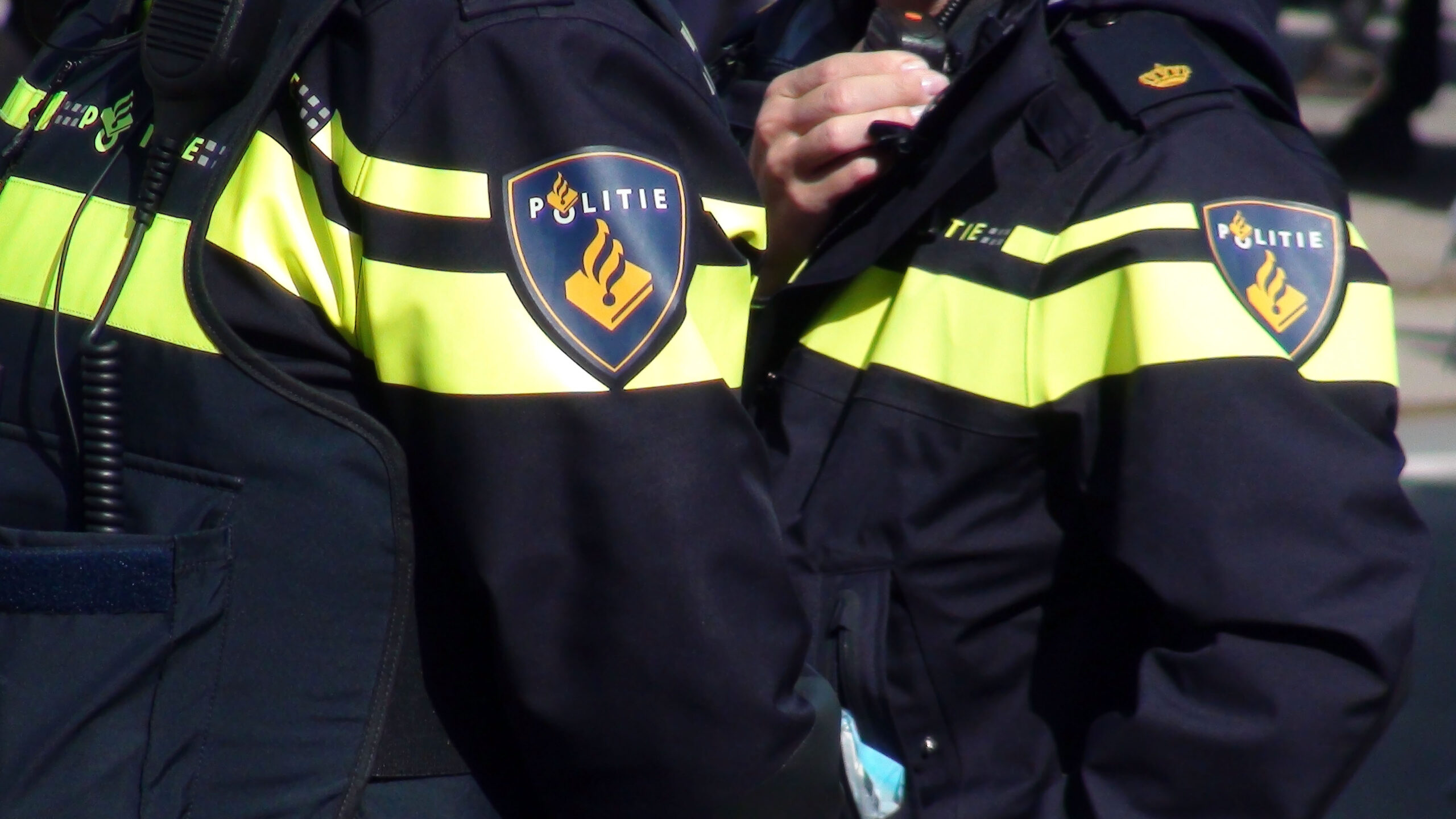 Dutch Local Police Officers In Police Uniform Standing On The Street Of ...